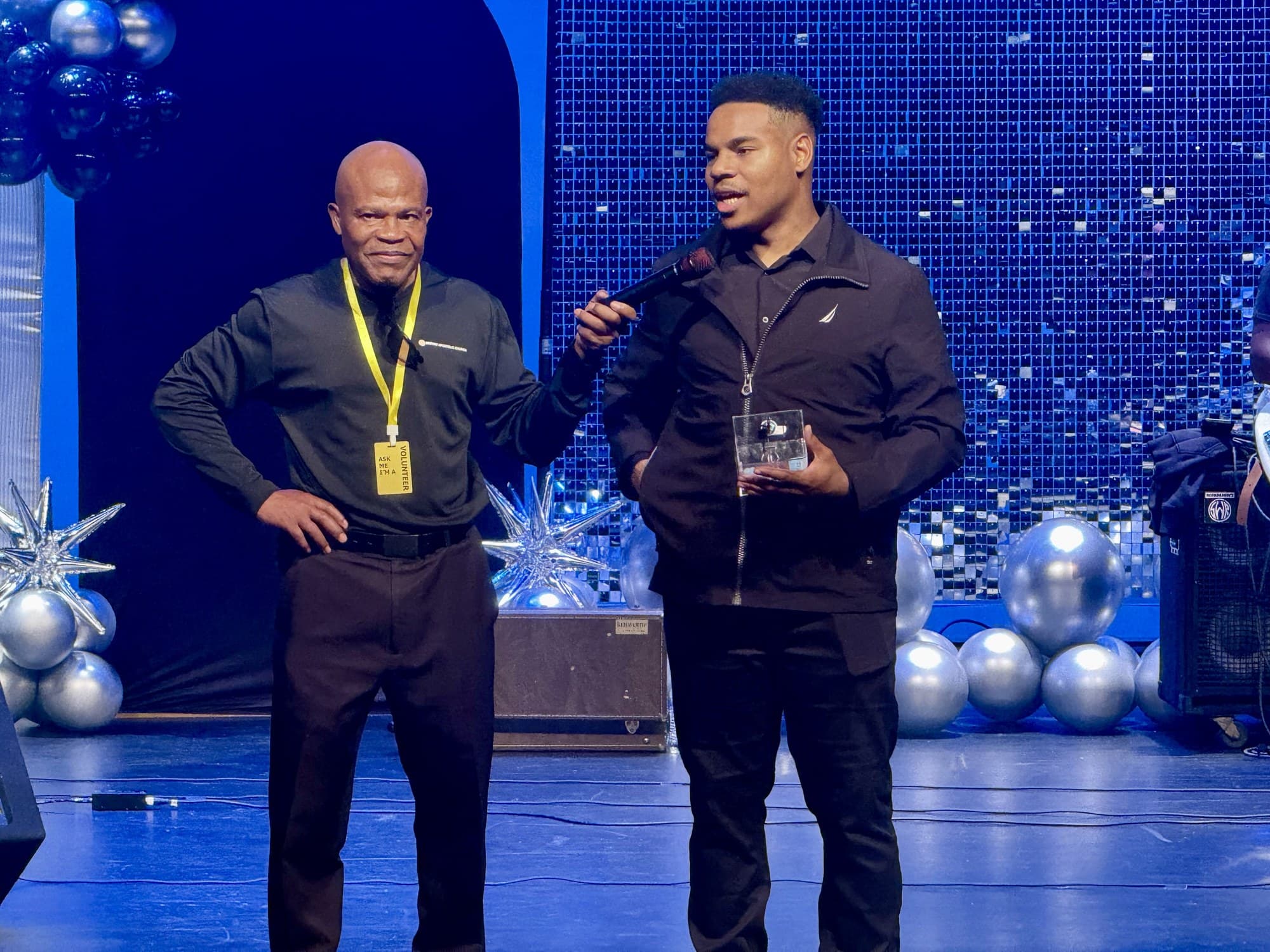 A Destiny volunteer helping recognize a guest during a church event