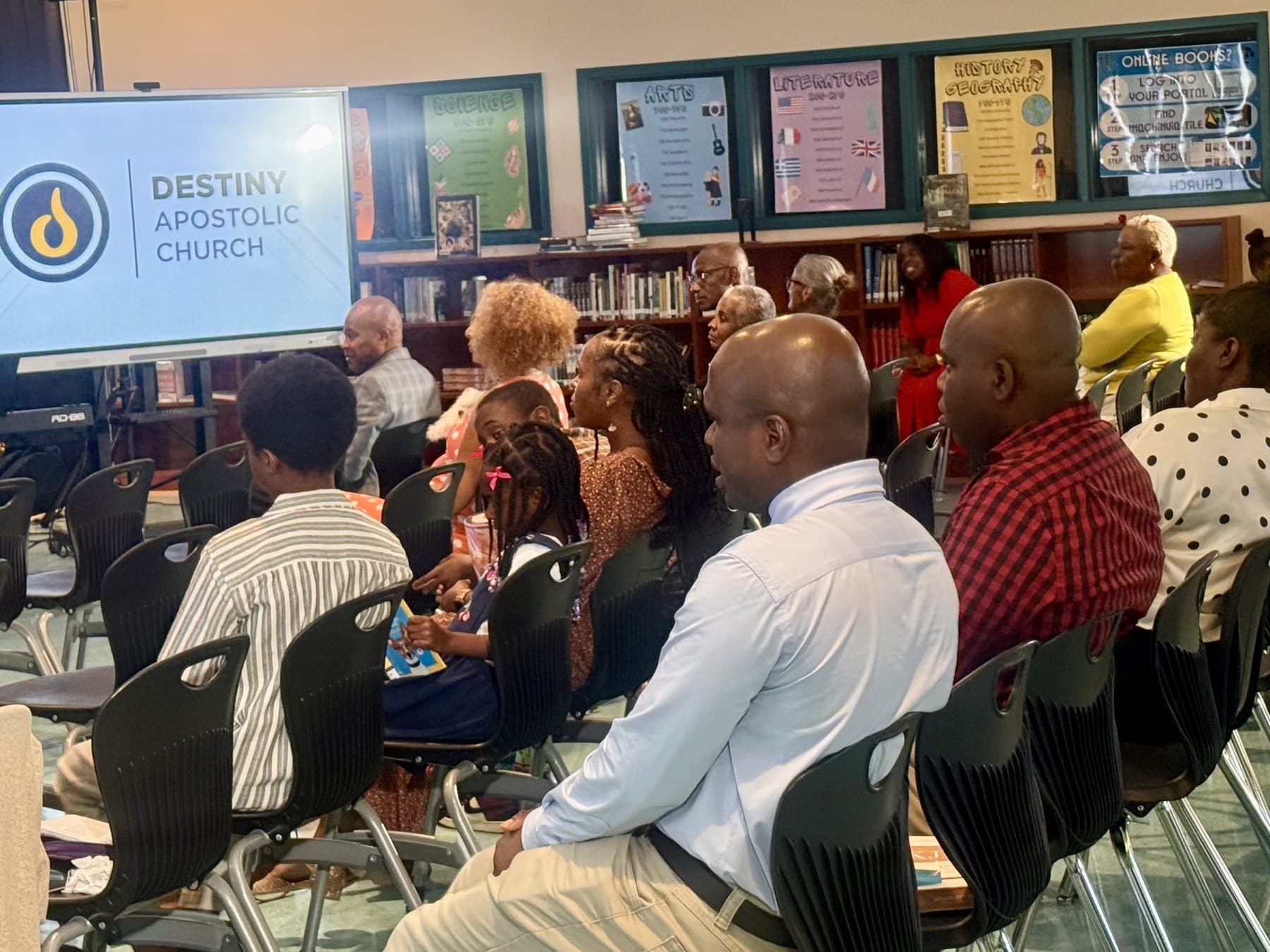 Adults and children gathered for a Destiny Apostolic Sunday service