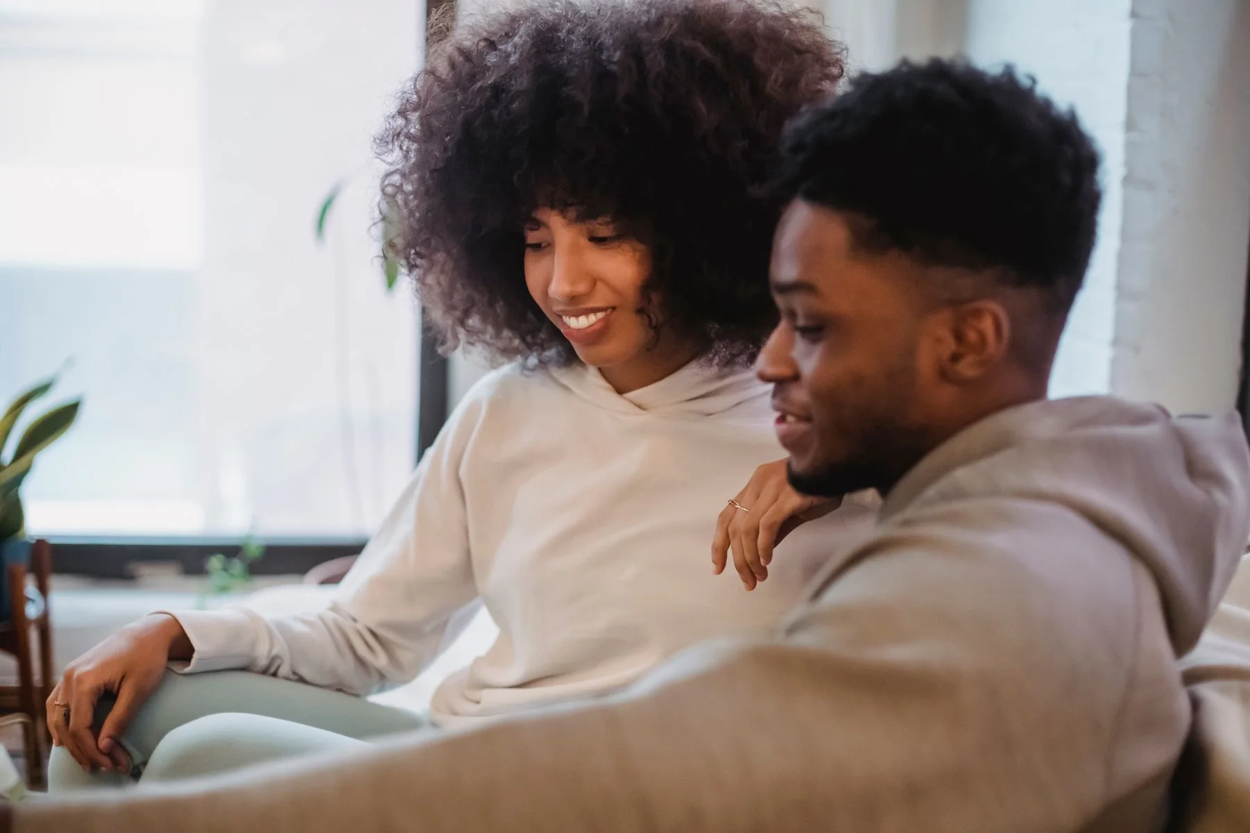 A smiling couple sharing a relaxed moment together
