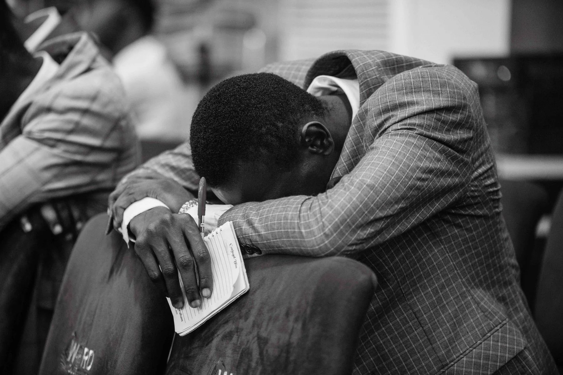A man praying during a church gathering